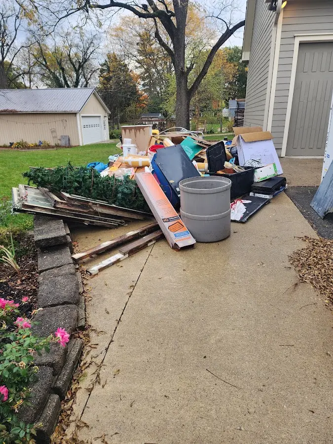 Dumpster being loaded with debris for 30 Yard Dumpster Rental in Union Beach